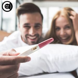 A happy couple holding a pregnancy test