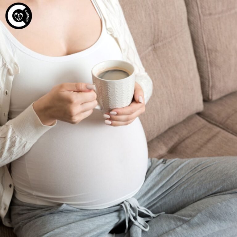 Steaming mug of coffee beside positive pregnancy test showing the caffeine dilemma for expectant mothers