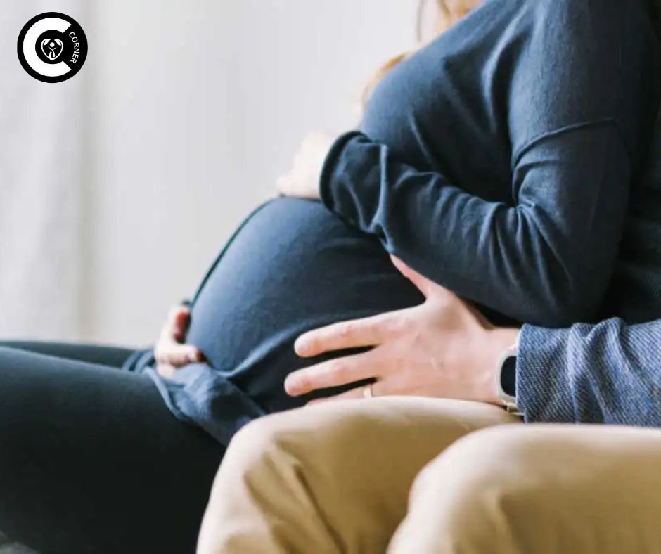 Illustration of a pregnant woman and partner hugging safely, highlighting first-trimester sex precautions